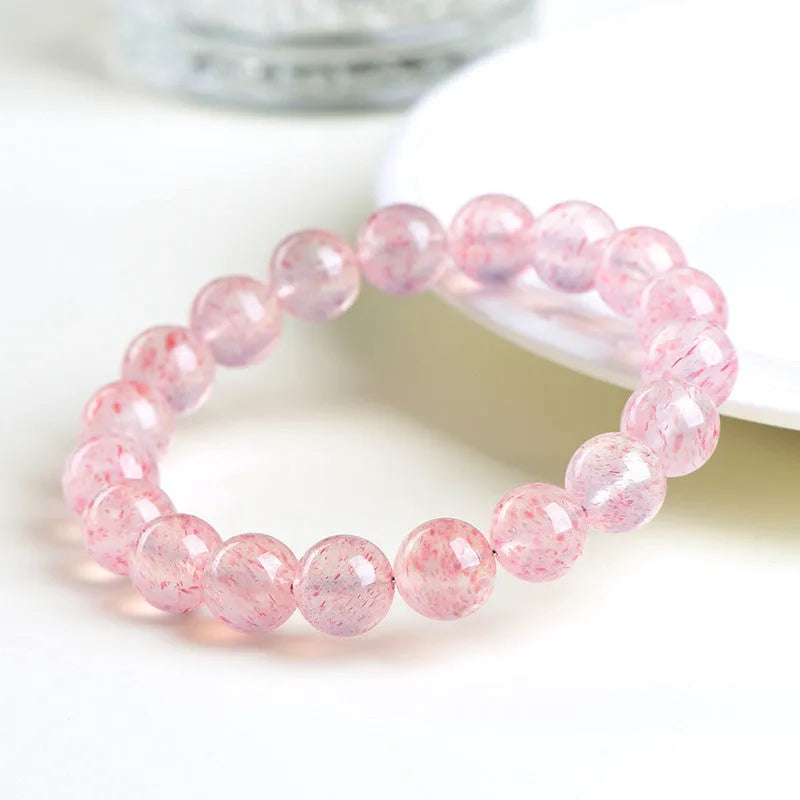 Strawberry quartz crystal bracelet with 10-10.8mm geometric beads in natural white water colour