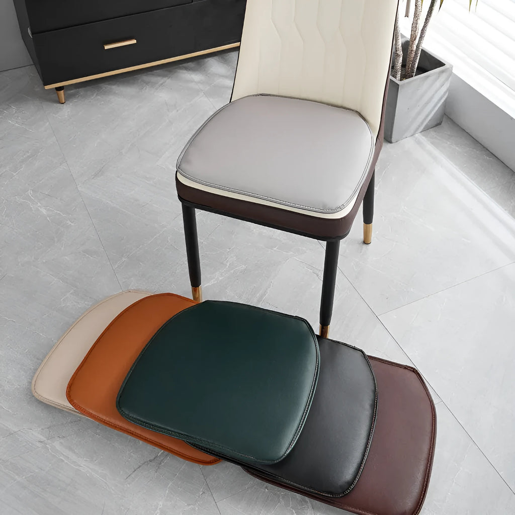 Leather horseshoe-shaped non-slip seat cushion in beige, shown on a chair.
