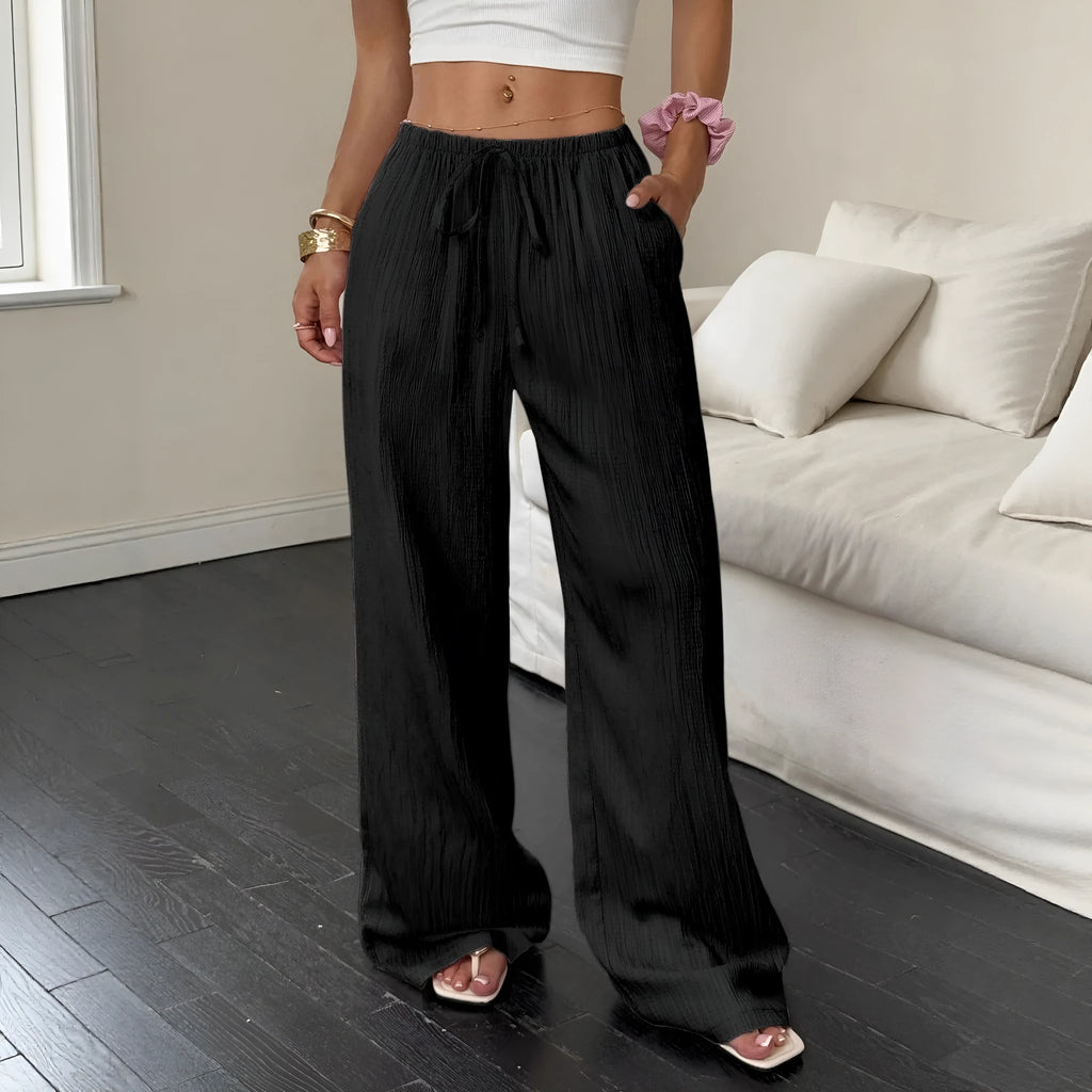 Women's black wide leg trousers with lace-up waist trimming detail on mid waist
