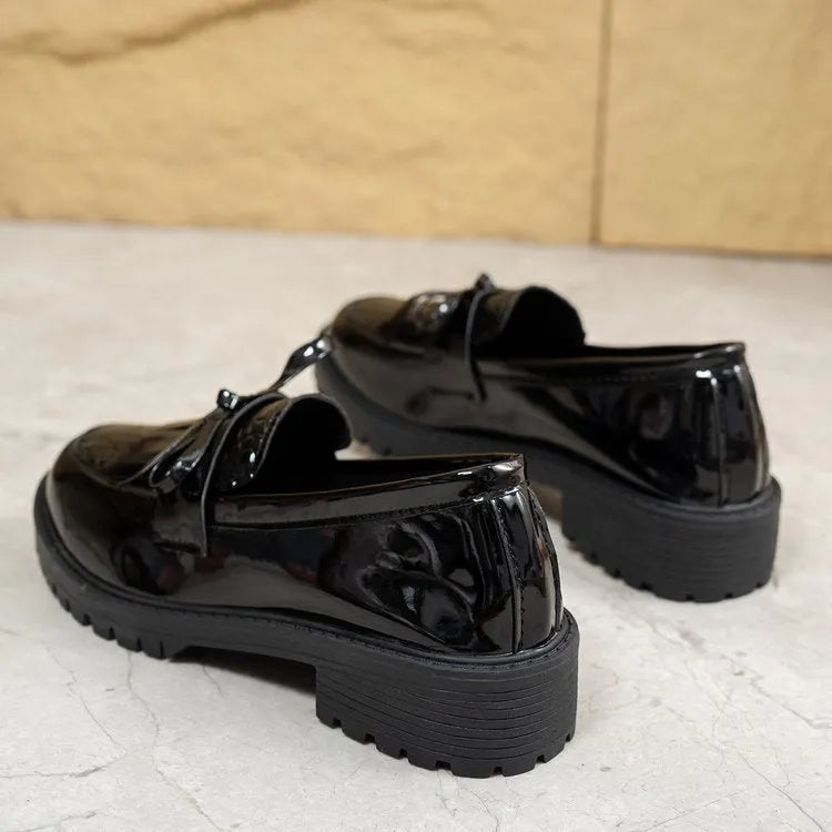 Women's brown loafers with decorative bow detail on artificial PU upper
