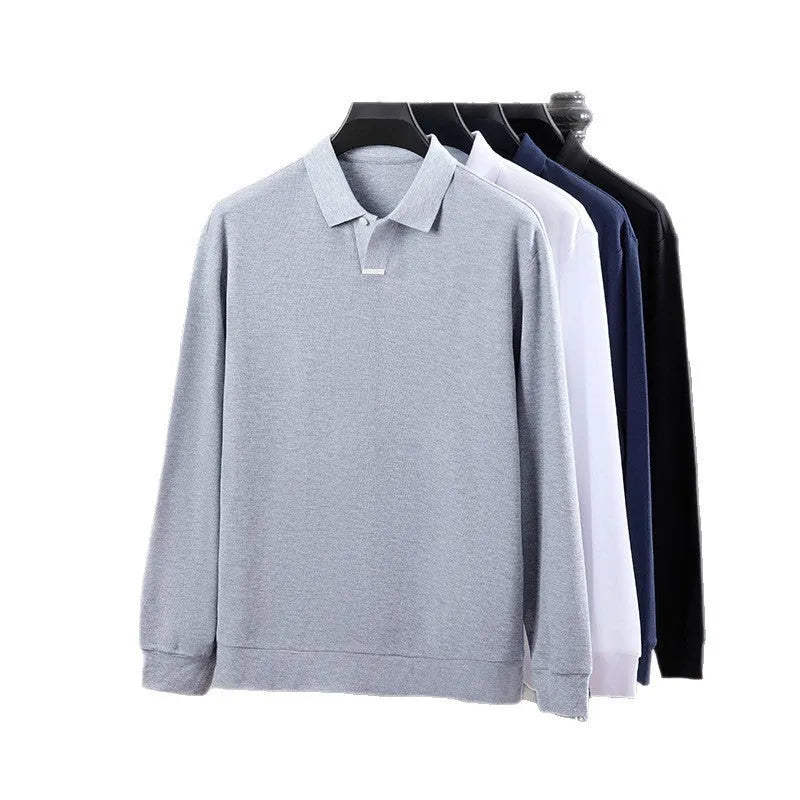 Man wearing a loose-fit grey cotton polo shirt with an asymmetric design and long sleeves.