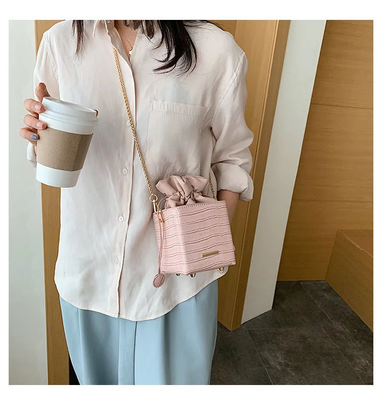One shoulder messenger bag with fashion chain detail in bucket shape available in six colours