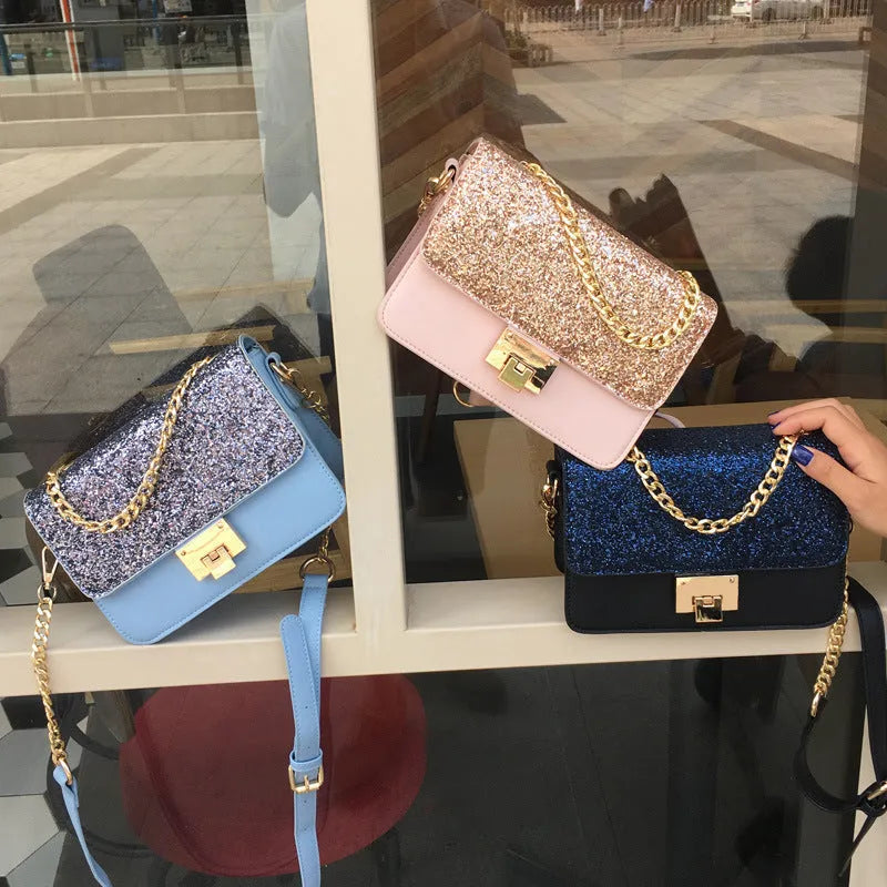Women's small square sequined PU handbag with lock closure and adjustable shoulder strap in pink, wathet, and black colours 22x16x9cm