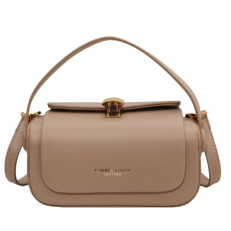 Personalised women's shoulder messenger bag in PU leather, shown in beige with a monogram letter and stitching detail.