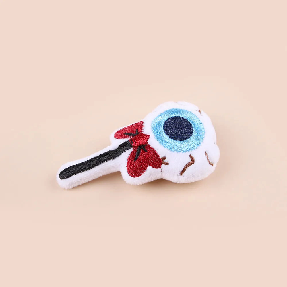 Small plush cat teaser wand with colourful eyes candy skull designs and feathers