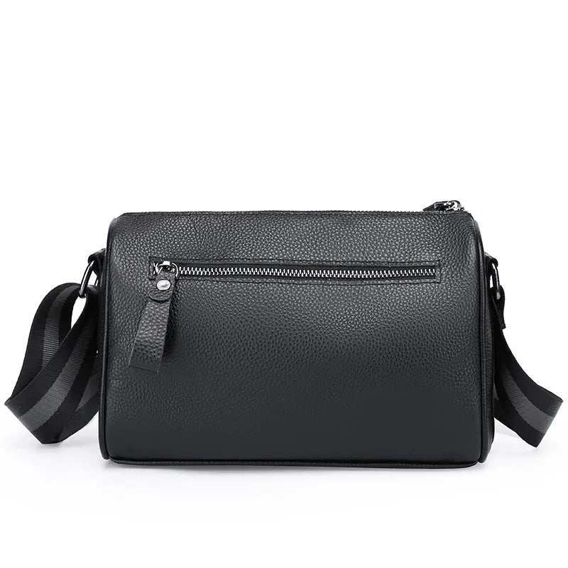 Black genuine leather one-shoulder crossbody bag showing 24x16x13cm dimensions and polyester lining interior