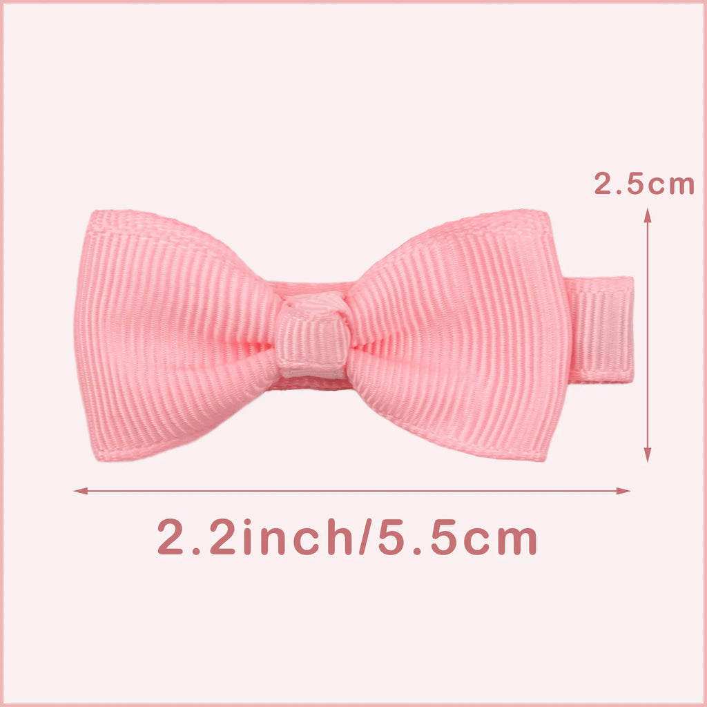 Assortment of pastel coloured fully lined hair clips and bows for babies and toddlers.