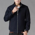 Men's gray polyester fleece autumn coat with long sleeves and side pockets in a sports style.