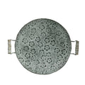 Round wrought iron storage tray in two sizes on a wooden table.