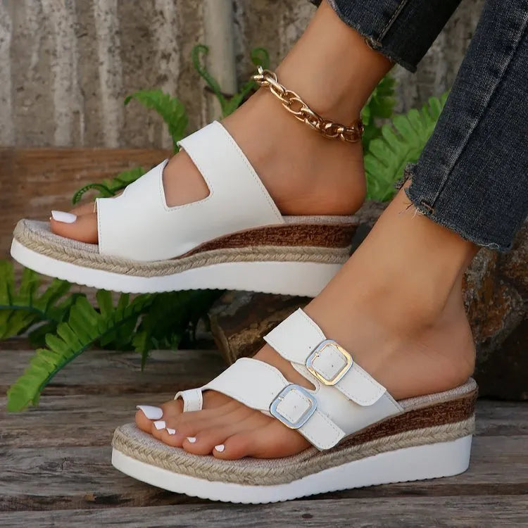 White patent leather wedge sandals with woven upper and finger-fit toe separation design