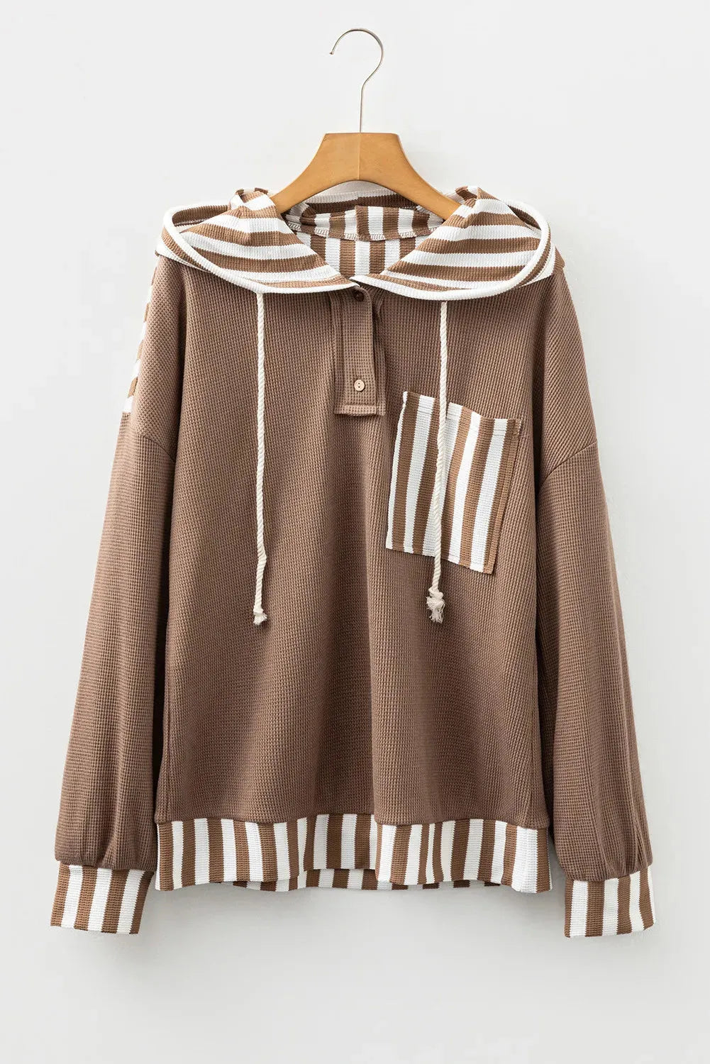 Straw yellow waffle texture hoodie with striped patchwork panels and a button neck.