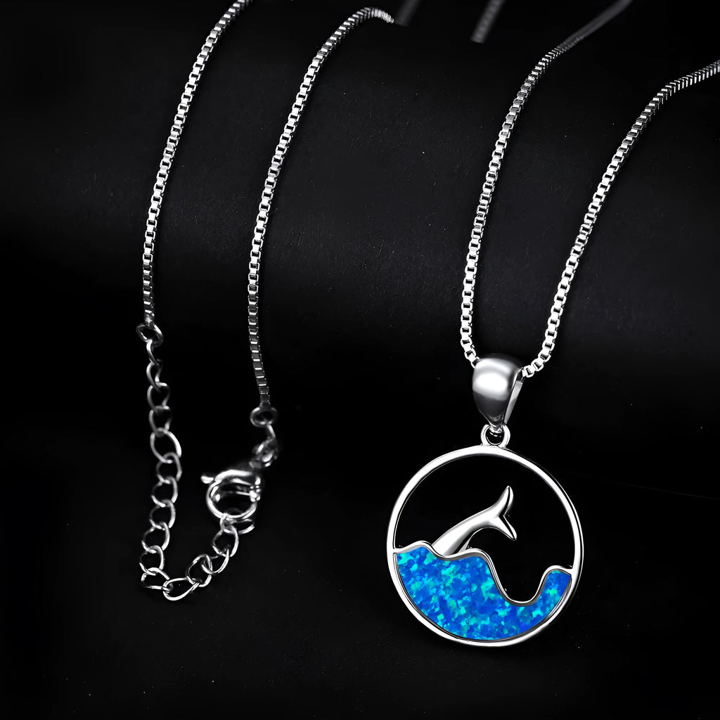 White gold electroplated geometric fishtail pendant necklace with a round blue opal stone.