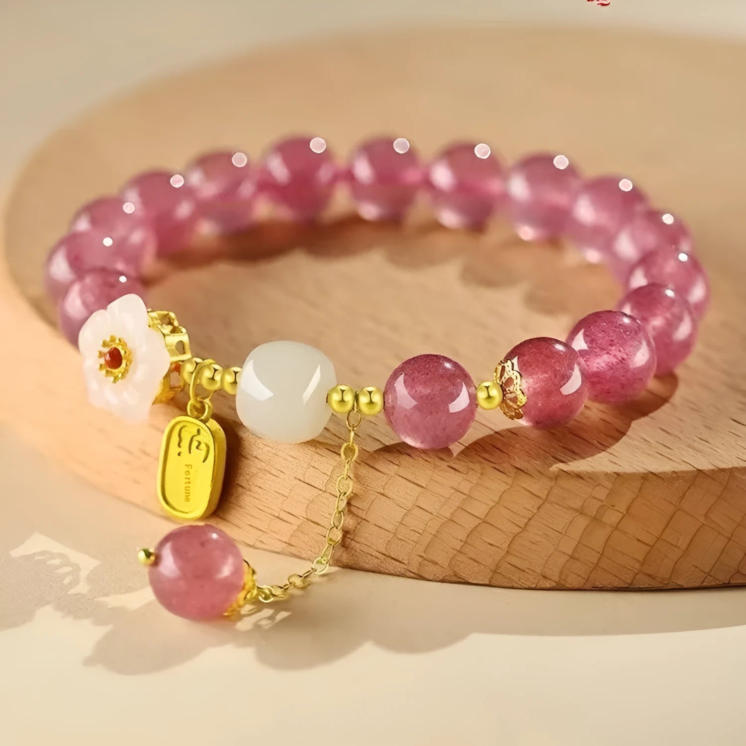 Handmade strawberry quartz crystal bracelet for women showing natural bead designs