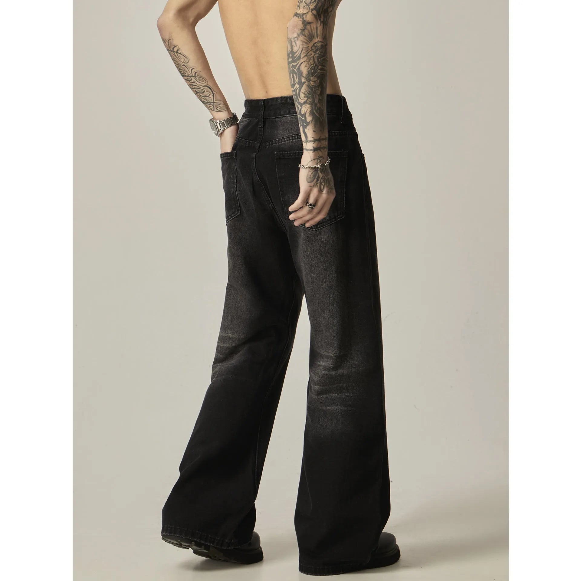 Black loose straight jeans with retro American styling and zipper fly opening