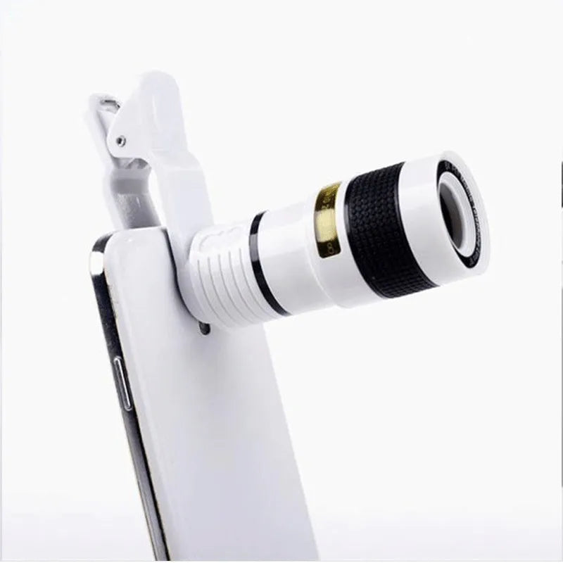 12X magnification black phone telescope lens with mounting clip extended next to a smartphone.