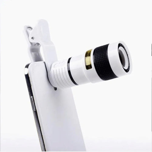 12X magnification black phone telescope lens with mounting clip extended next to a smartphone.