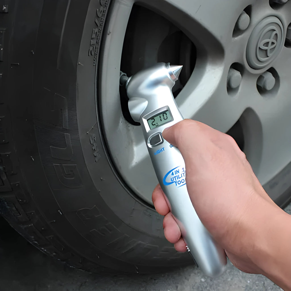 Silver four-in-one digital tire pressure gauge with display, stainless steel hammer, and emergency light on car seat