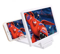Foldable black mobile phone stand with integrated 3D screen amplifier on a table