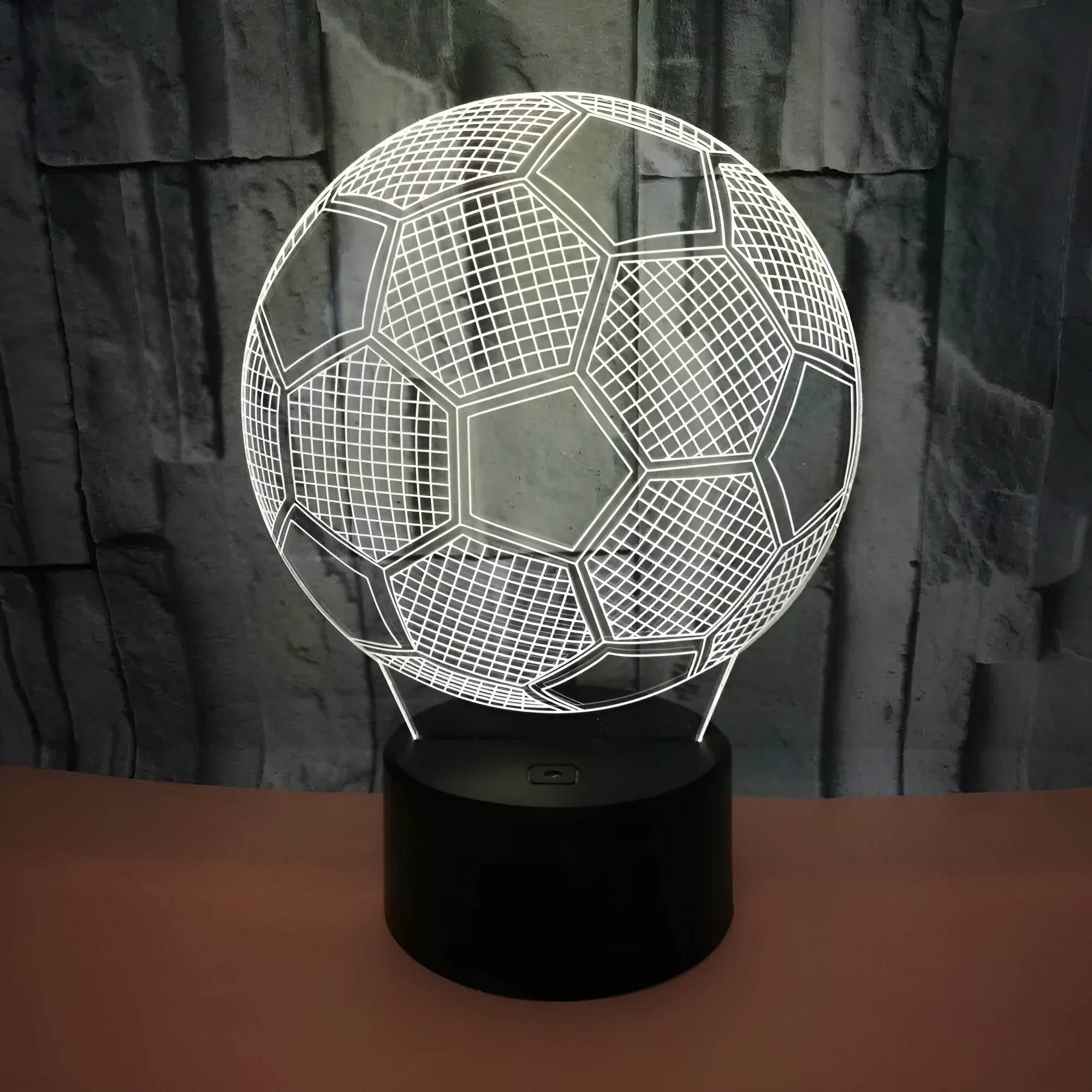 3D football themed night light showing multiple colour options on a black base