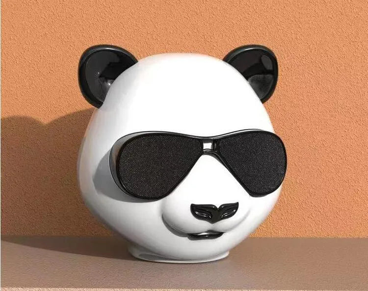 Classic style portable mini Bluetooth speaker on a surface, showing its compact design.