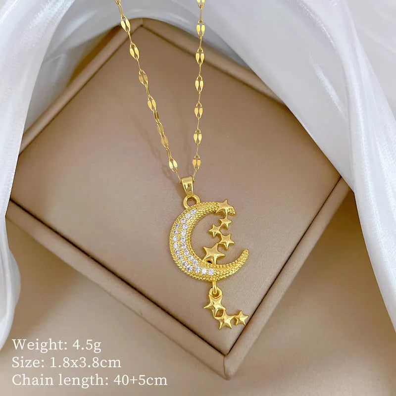 Geometric moon pendant necklace with tassel detailing and diamond accents on copper