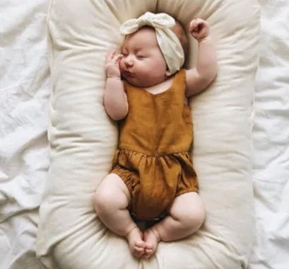 Portable baby nest crib measuring 75x45cm in cotton fabric with PP cotton filler