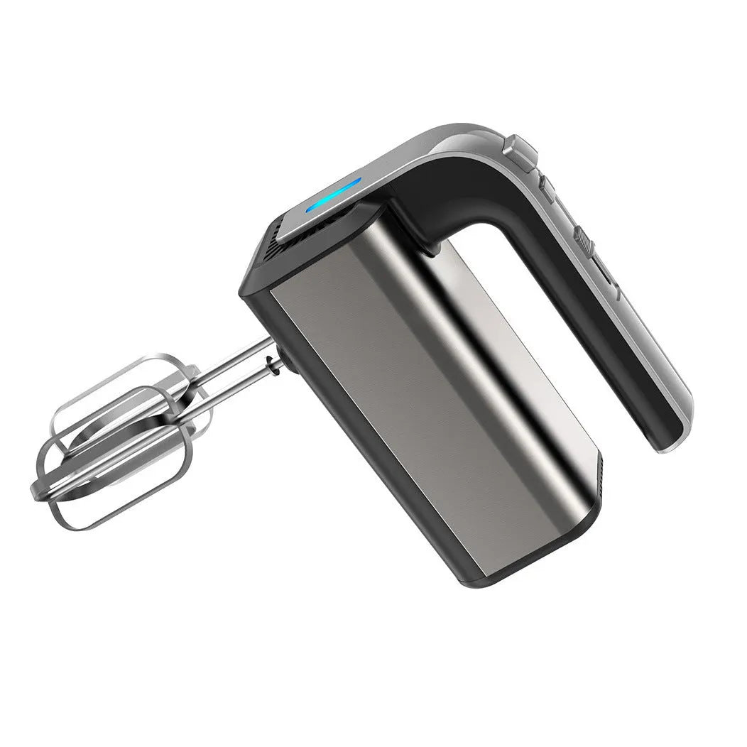Silver mini electric hand whisk with stainless steel beaters on a kitchen counter.