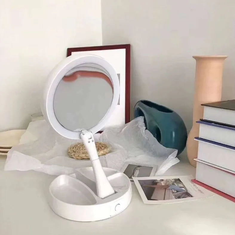 White acrylic frame double-sided LED vanity mirror folded with storage shelf visible