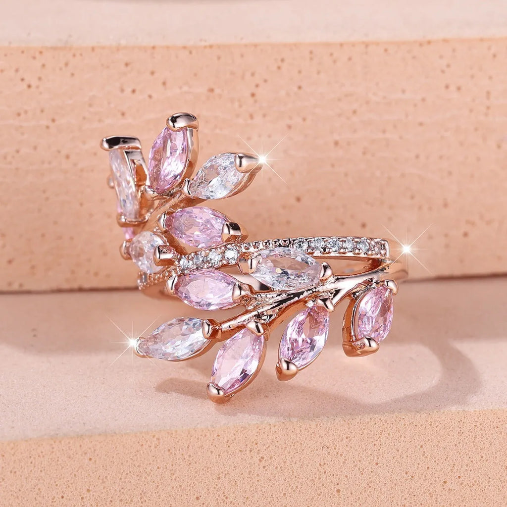 Adjustable copper leaf-shaped fashion ring with a central horse eye zircon stone in a rose gold finish.