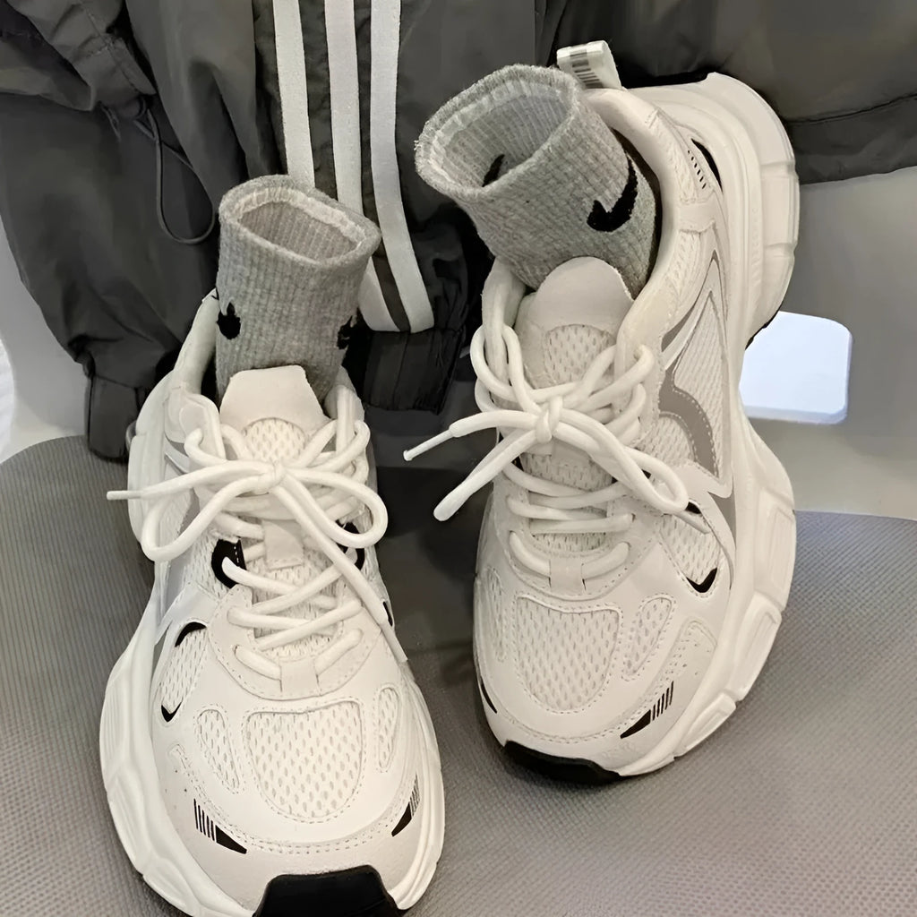 Beige women's mesh platform sports shoes with a wedge heel and lace-up front.