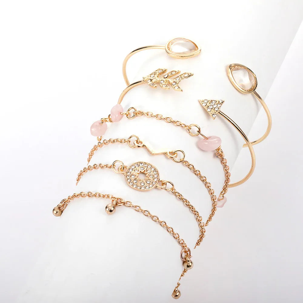 Gold zinc alloy women's bracelet set with arrow, water drop, and V-shaped pendants
