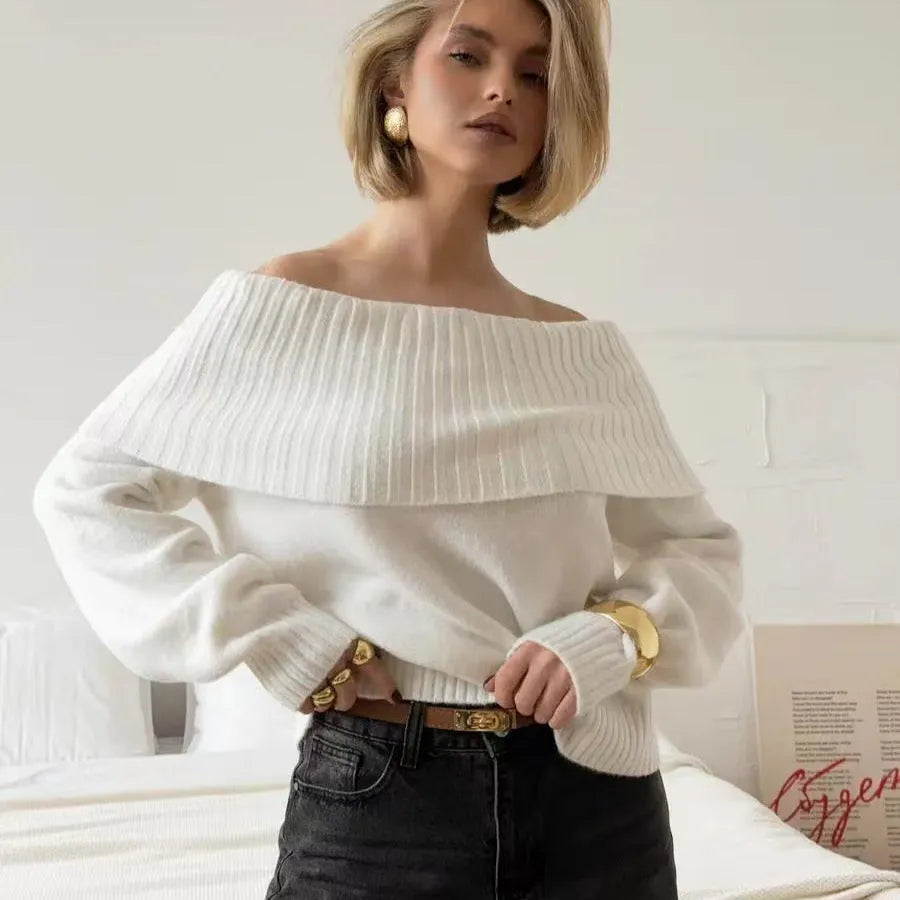 Grey strapless off-the-shoulder acrylic sweater with a 3D pattern, shown as a pullover.