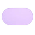 Silicone waterproof placemat for cat food and water bowls in beige colour on a wooden floor.