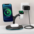 Black three-in-one magnetic wireless charger with a simplistic design on a table.