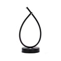 Black and white water drop shaped USB bedside lamp with touch and switch control.