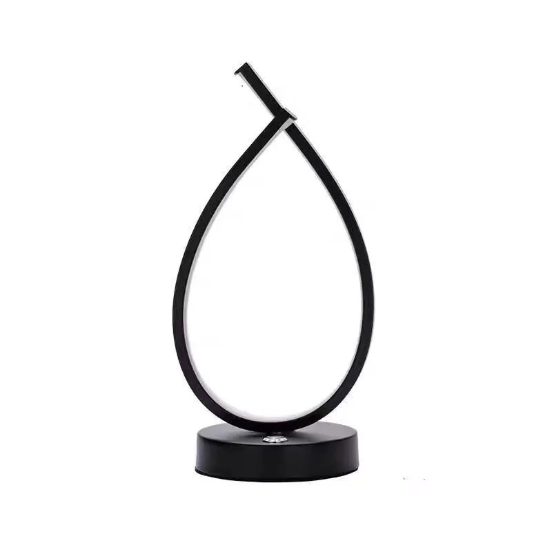 Black and white water drop shaped USB bedside lamp with touch and switch control.