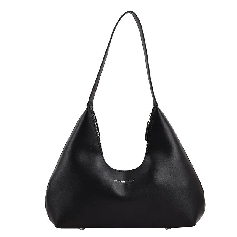 Brown retro PU leather shoulder handbag with a single strap and pillow-shaped design on a plain background.