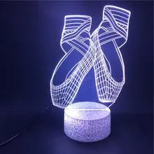 3D acrylic ballet dancer LED night light with remote control on an ABS base, showing colourful illumination.