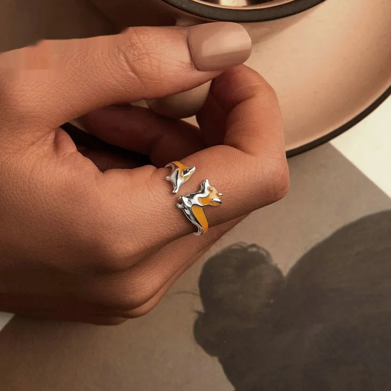 Silver-coloured adjustable ring with a detailed cartoon Corgi dog design.