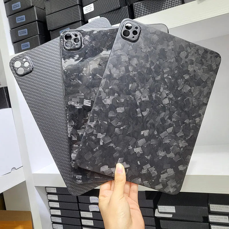 Genuine carbon fibre flat protective cover for Apple iPad Pro 11 with embossed plaid pattern.