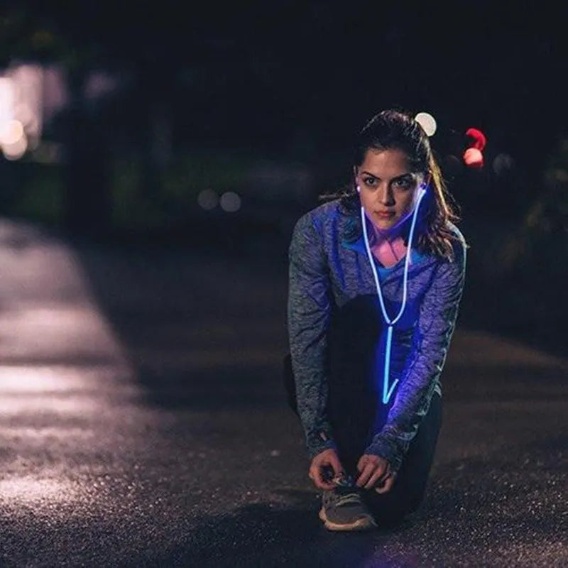 Magic Light LED Earphones with illuminated cable and aluminium alloy earpieces in blue, green, or pink.