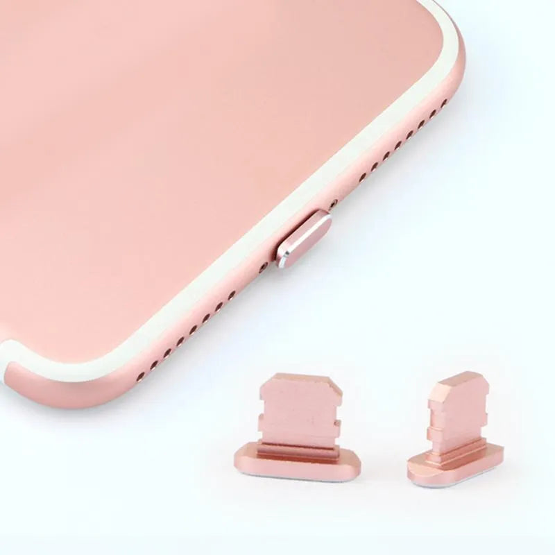 Aluminium alloy dust plug for iPhone charging port in a selection of colours including gold, silver, and rose gold.