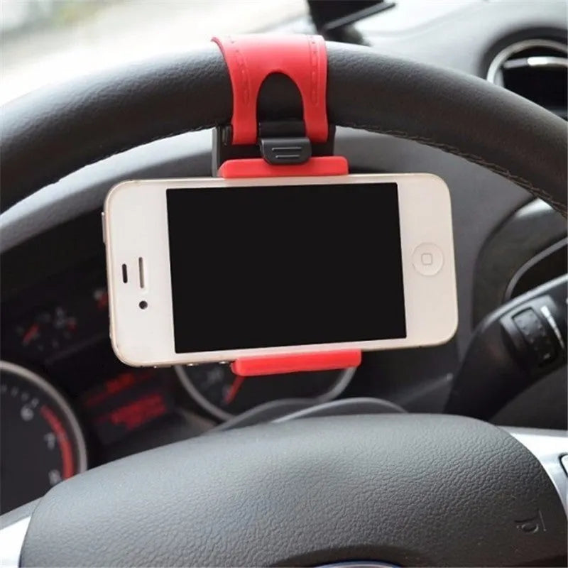 Universal black steering wheel phone mount holder clipped onto a car wheel