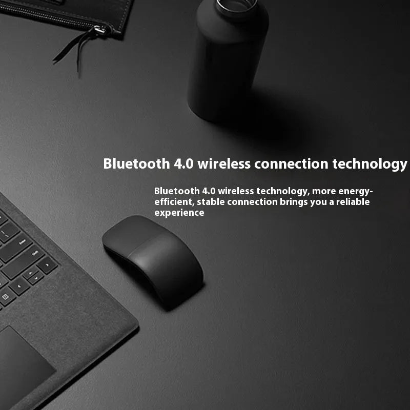 Folding Bluetooth wireless mouse shown in black, demonstrating its compact 131.2mm length and touch surface.