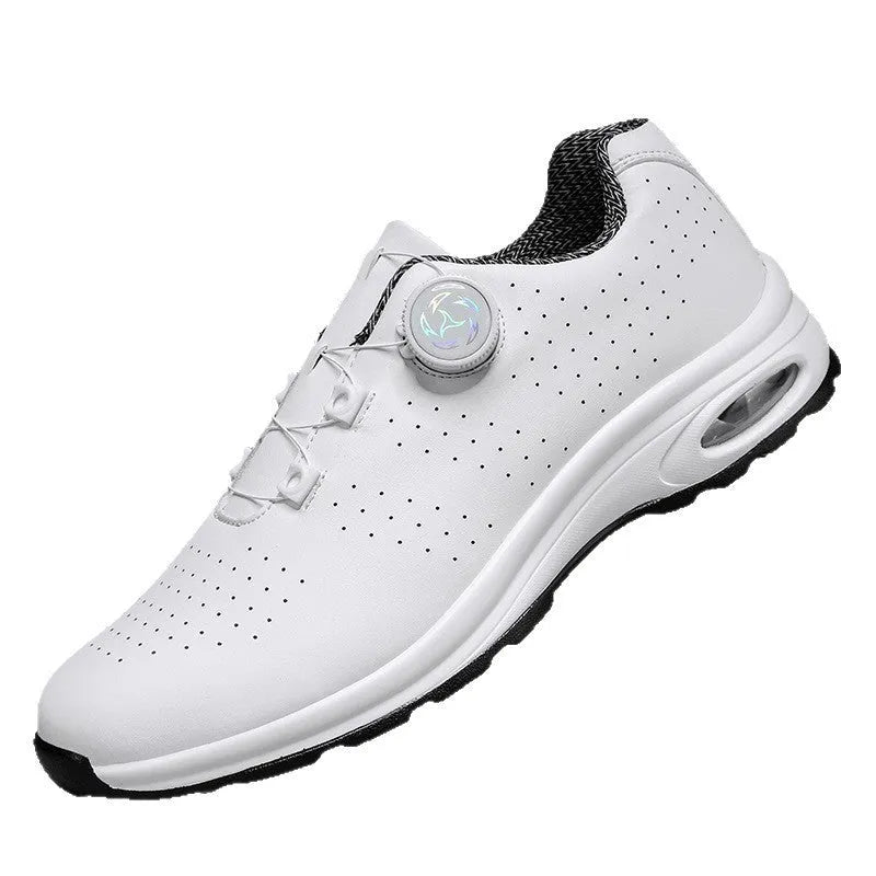Black and white low-top casual tennis shoes with mesh upper, cross shoulder straps, and flat composite sole.