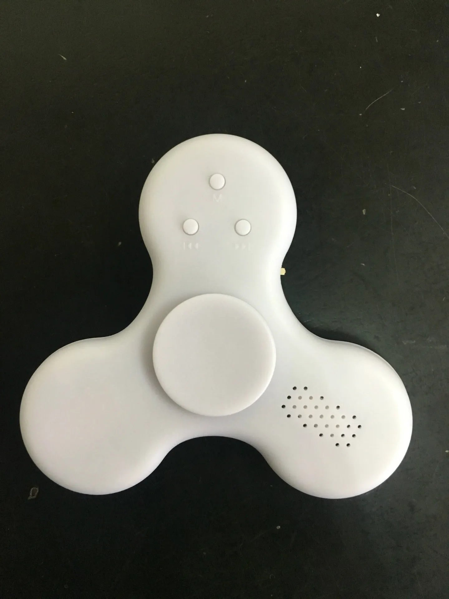Bluetooth speaker music fidget spinner EDC toy in white, showing portable ABS build