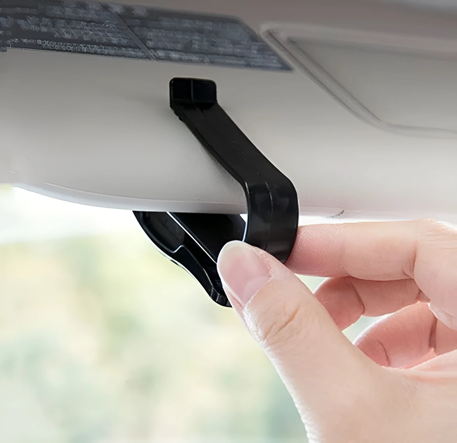 Black plastic car sunshade clip for organising glasses, tickets and identification cards