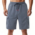 Men's loose grey Terry fabric cargo shorts with multiple pockets and elastic waist