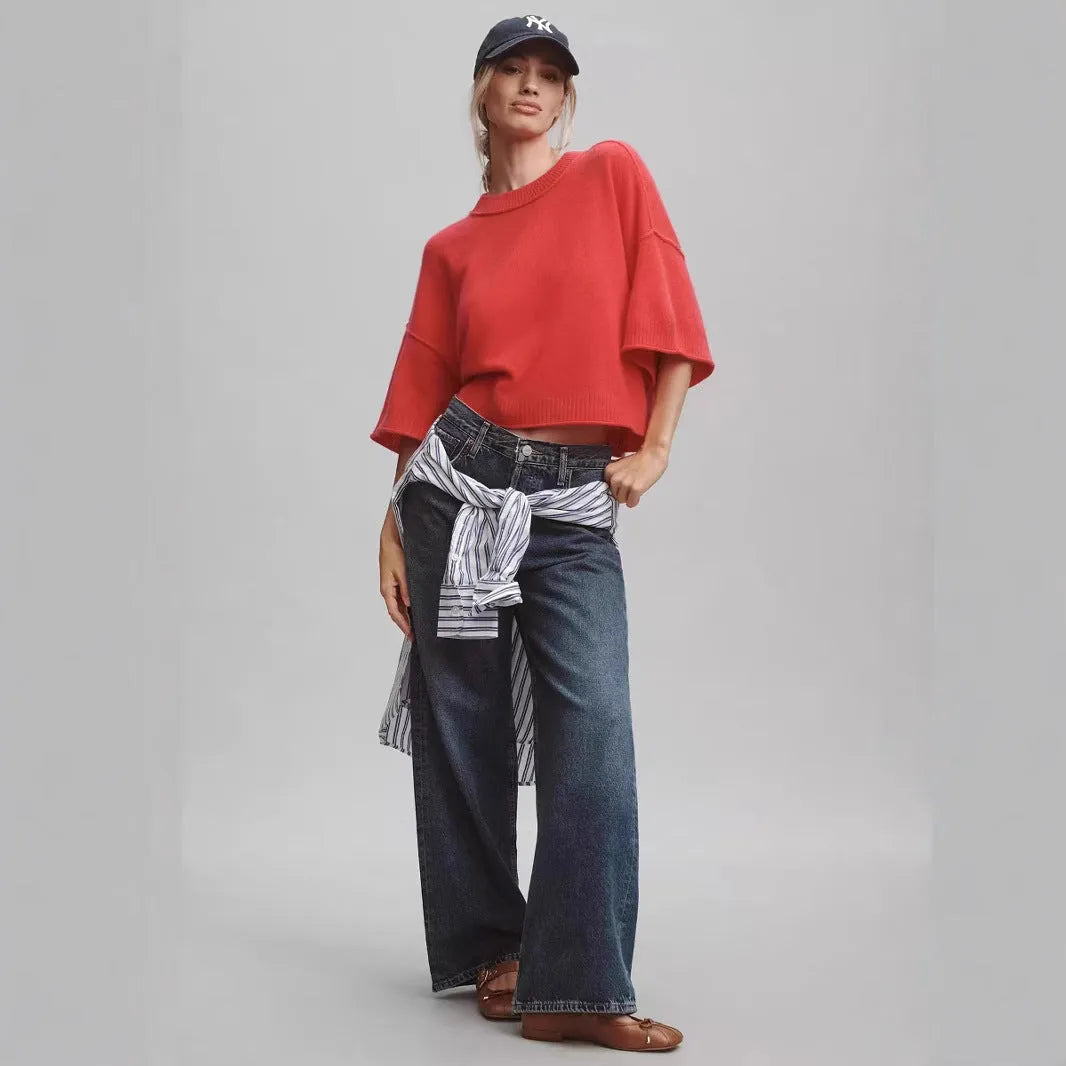 Red cropped t-shirt on a hanger, showing midriff length and regular sleeves.