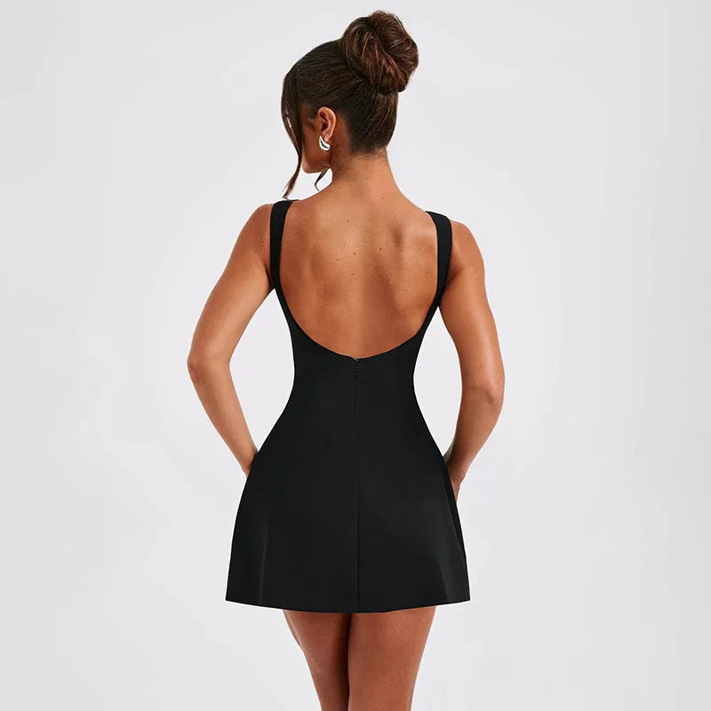 Slim-fitting backless sleeveless dress in polyester fabric, shown in a short length with a high waist.